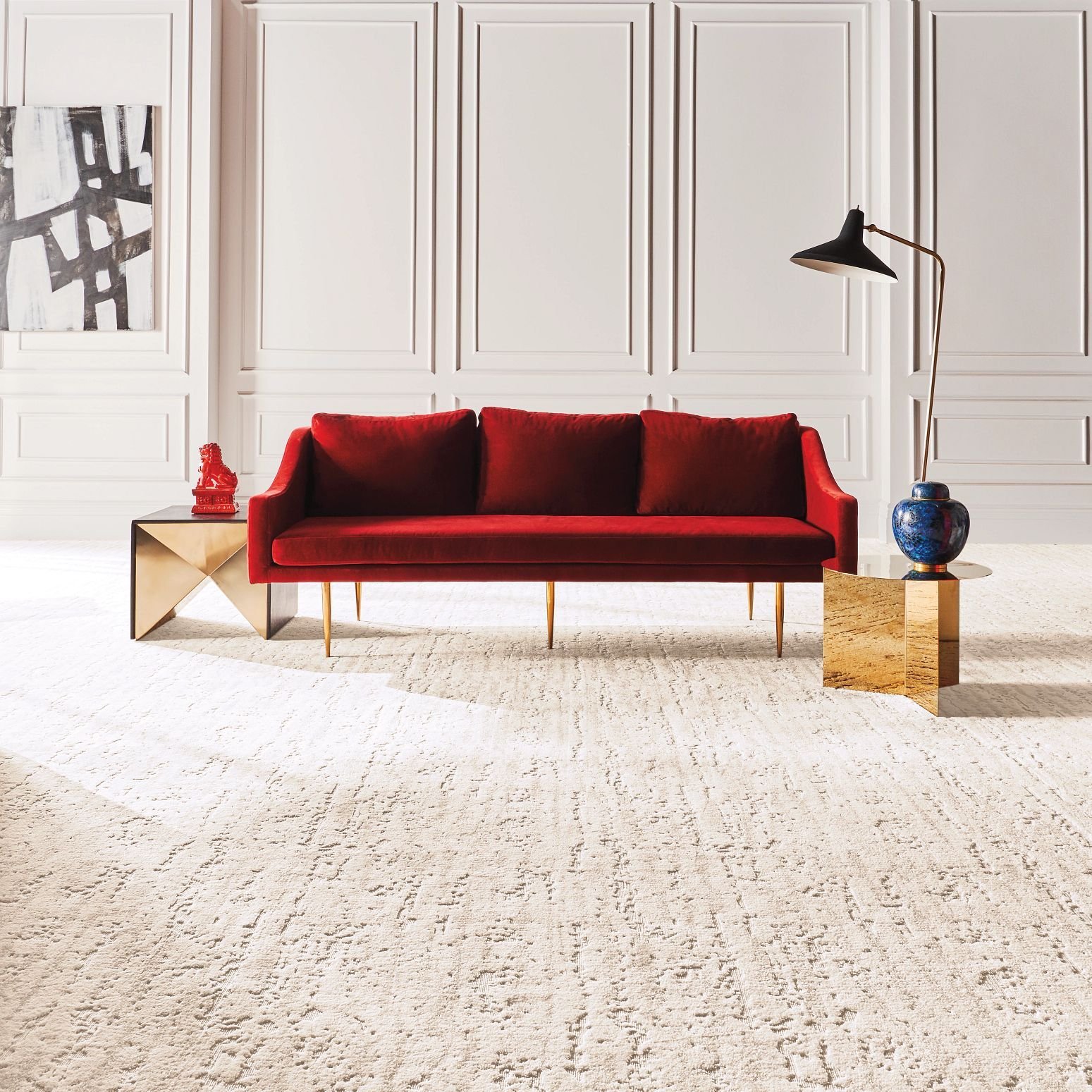 Red sofa on the carpet from Galbraiths Inc. Flooring in Carthage, MO